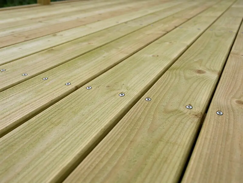 Close-up of pressure-treated wood deck boards (illustrative)